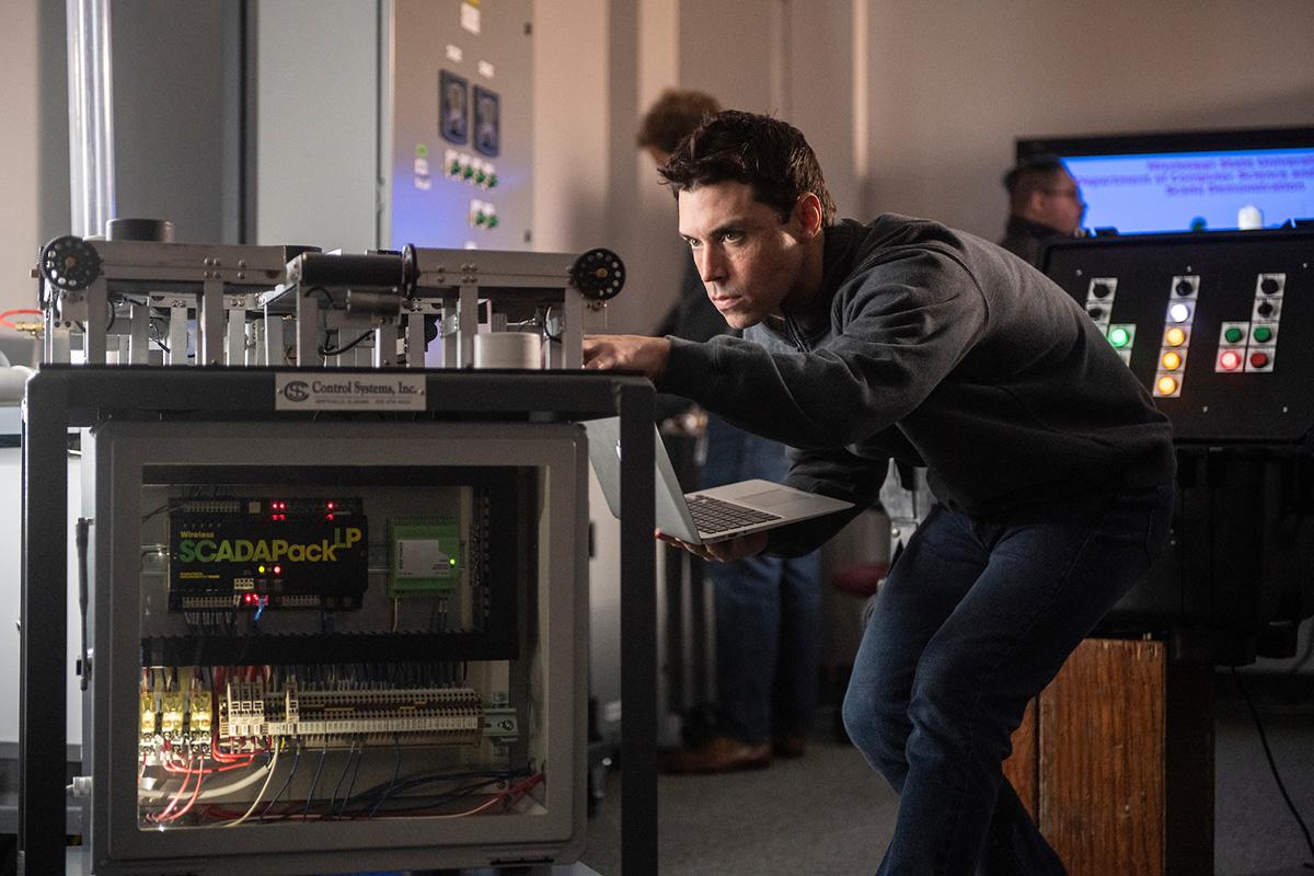 A researcher works on electronics