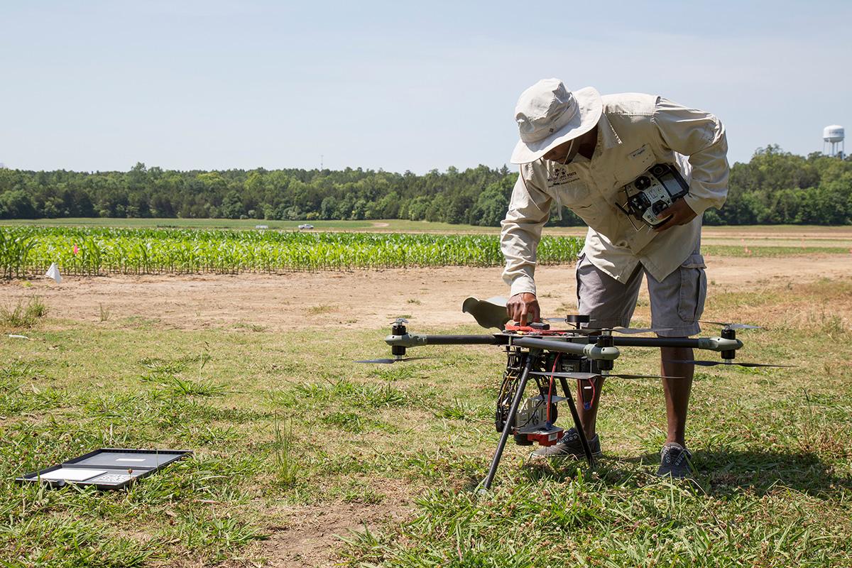 A researcher checks a drone